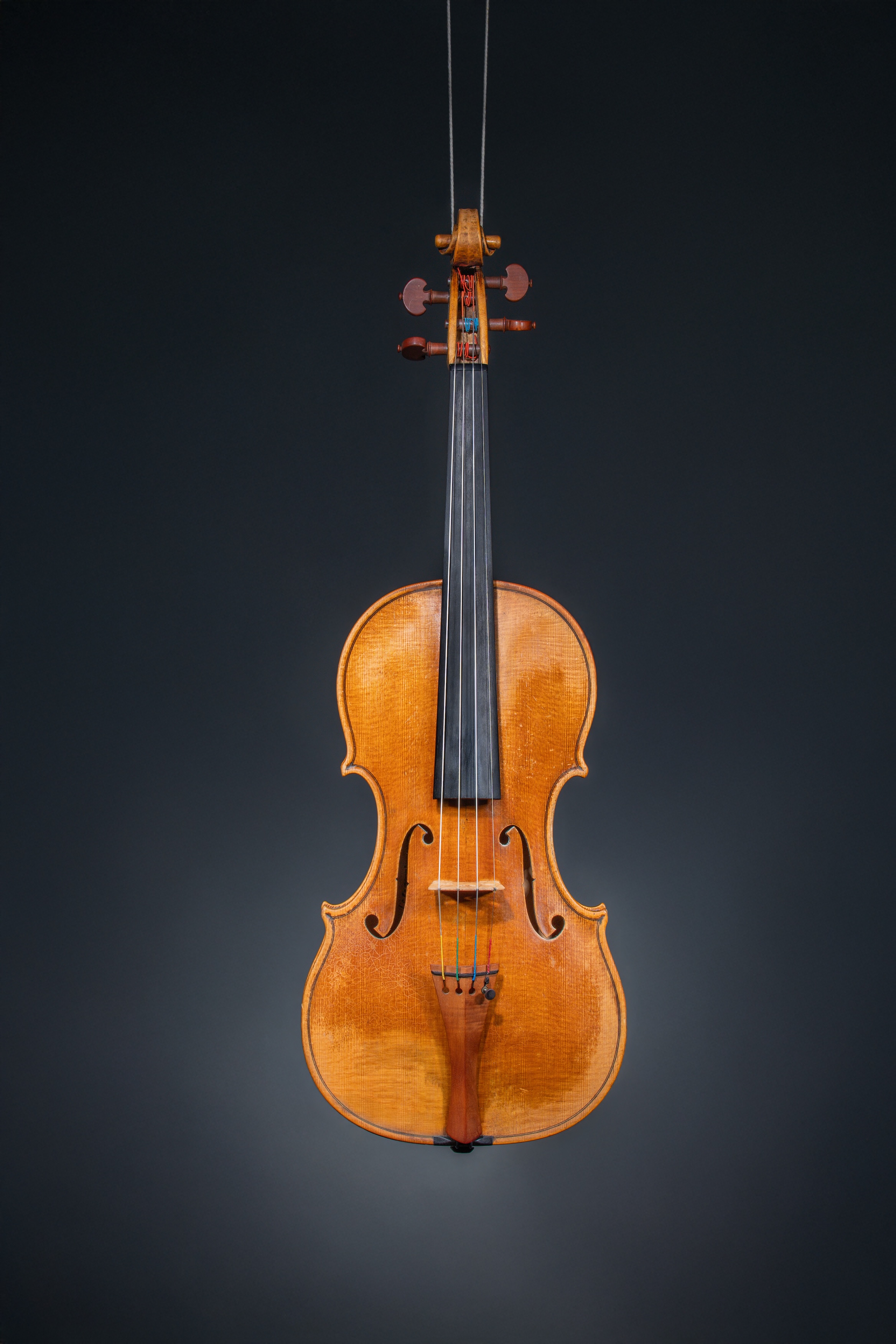 Violin F-holes and Strings